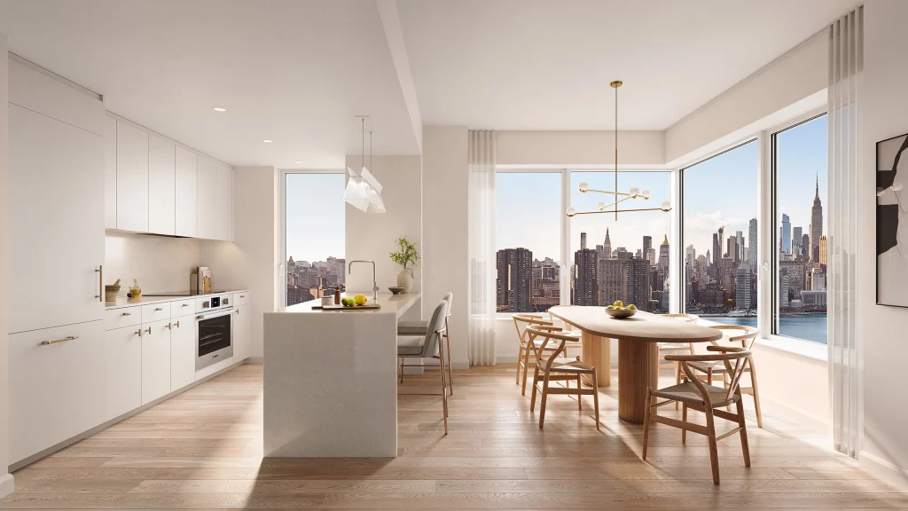 The Dupont residential kitchen with Blomberg and Bosch paneled appliances, featuring an induction cooktop. The kitchen has genuine hardwood oak flooring and cabinetry with custom wood hardware and quartz countertops and backsplashes.